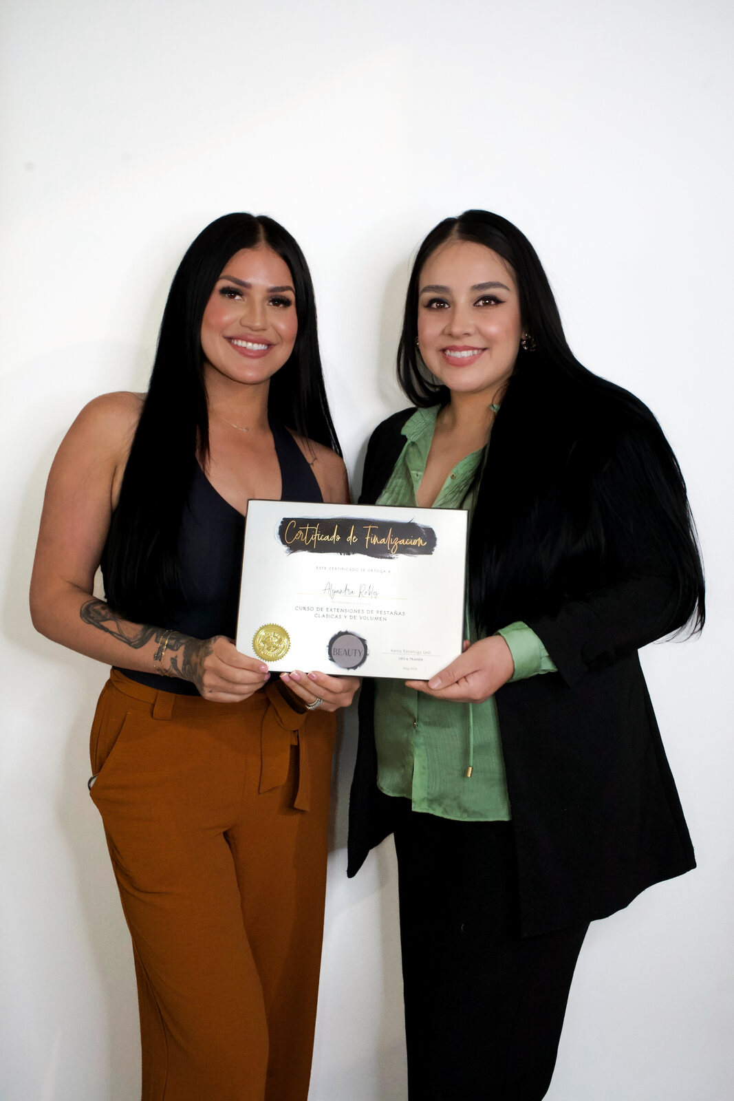 Kenia and a graduate holding her certificate