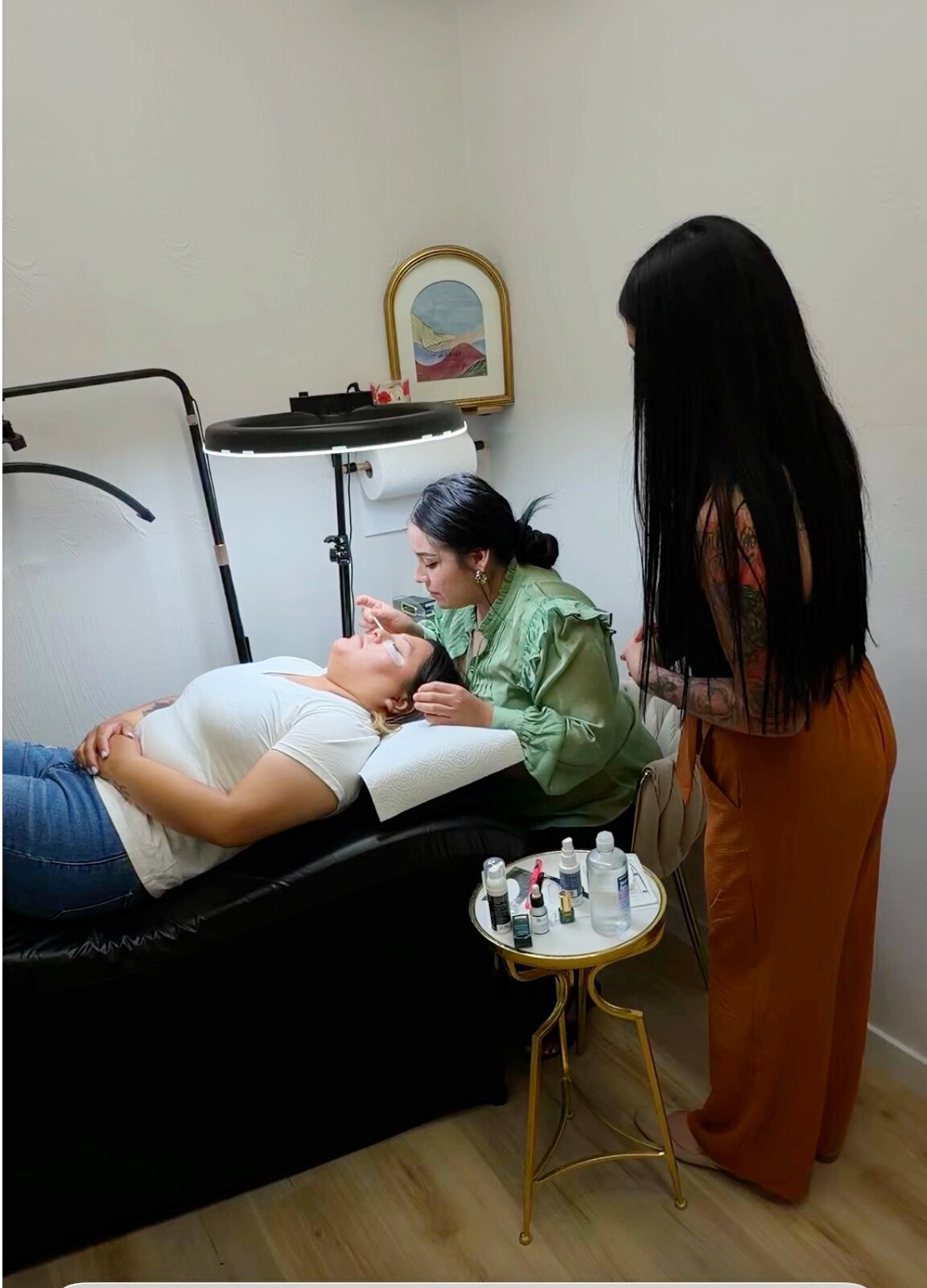 A student lashing a live model while Kenia watches
